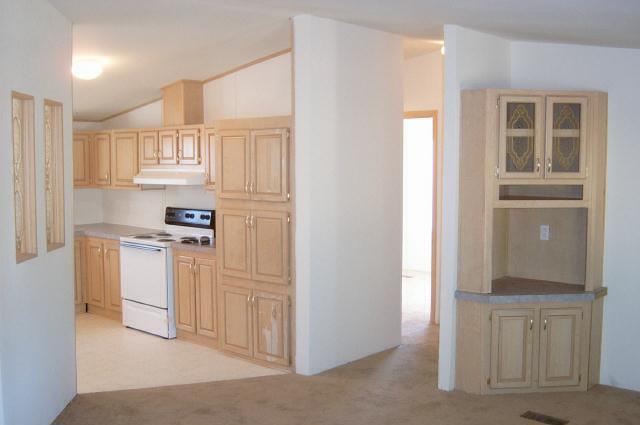 331 Vance Road Mabton, WA 98935 - Photo 2 of 9 a kitchen with white cabinets and white appliances
