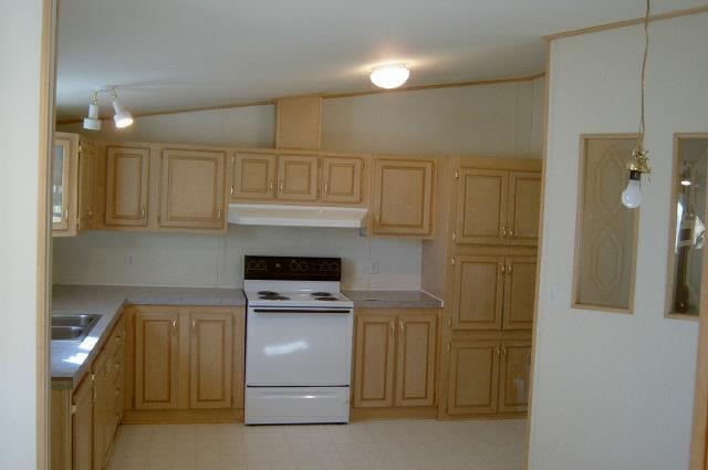 331 Vance Road Mabton, WA 98935 - Photo 3 of 9 a kitchen with cabinets and appliances