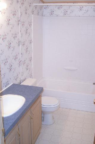 331 Vance Road Mabton, WA 98935 - Photo 6 of 9 a bathroom with a granite countertop toilet and a sink