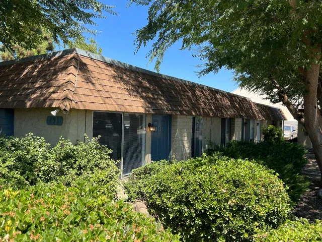 front view of a house with a garden