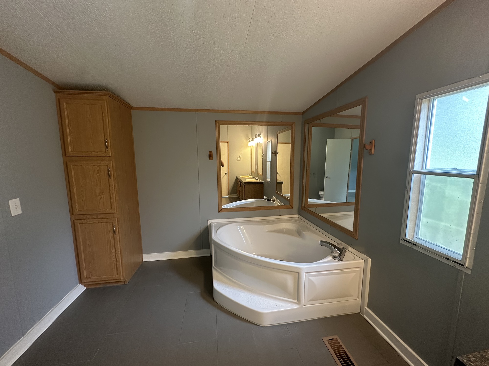 2229 Meekins Road Cleveland, TX 77328 - Photo 17 of 48 a white bath tub sitting in a bathroom