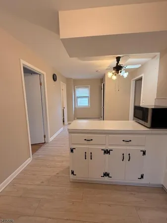 a bathroom with a sink vanity and mirror