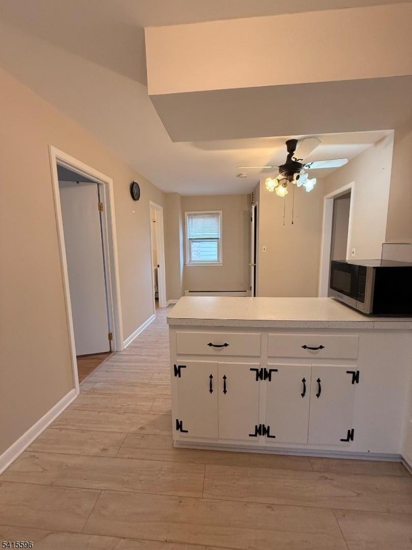 401 Raritan Road Linden, NJ 07036 - Photo 4 of 9 a bathroom with a sink vanity and mirror