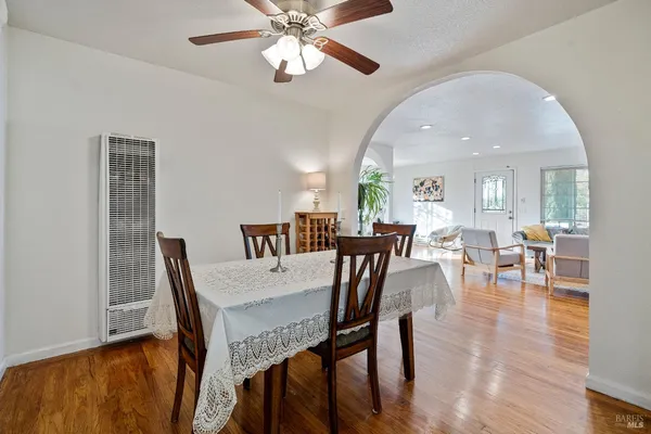 a view of a dining room with furniture and wooden floor