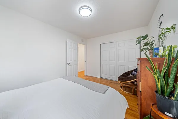 a bedroom with a bed and ceiling fan