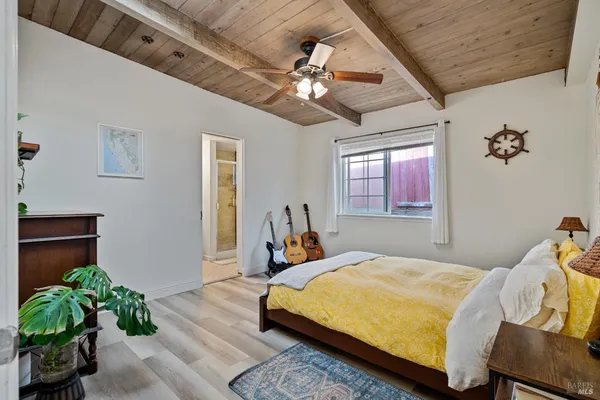 a bed room with a bed and a chandelier