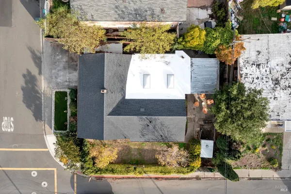 an aerial view of a house with a yard