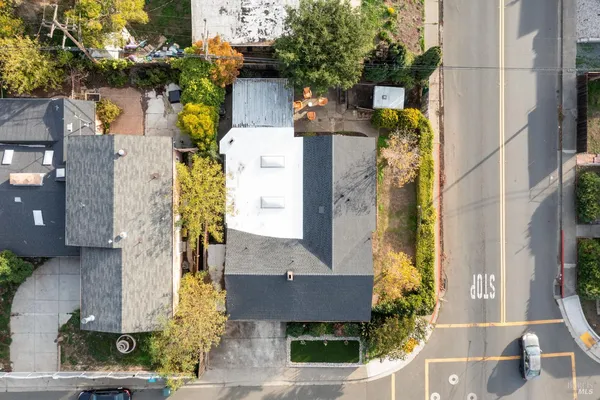 an aerial view of residential houses with outdoor space