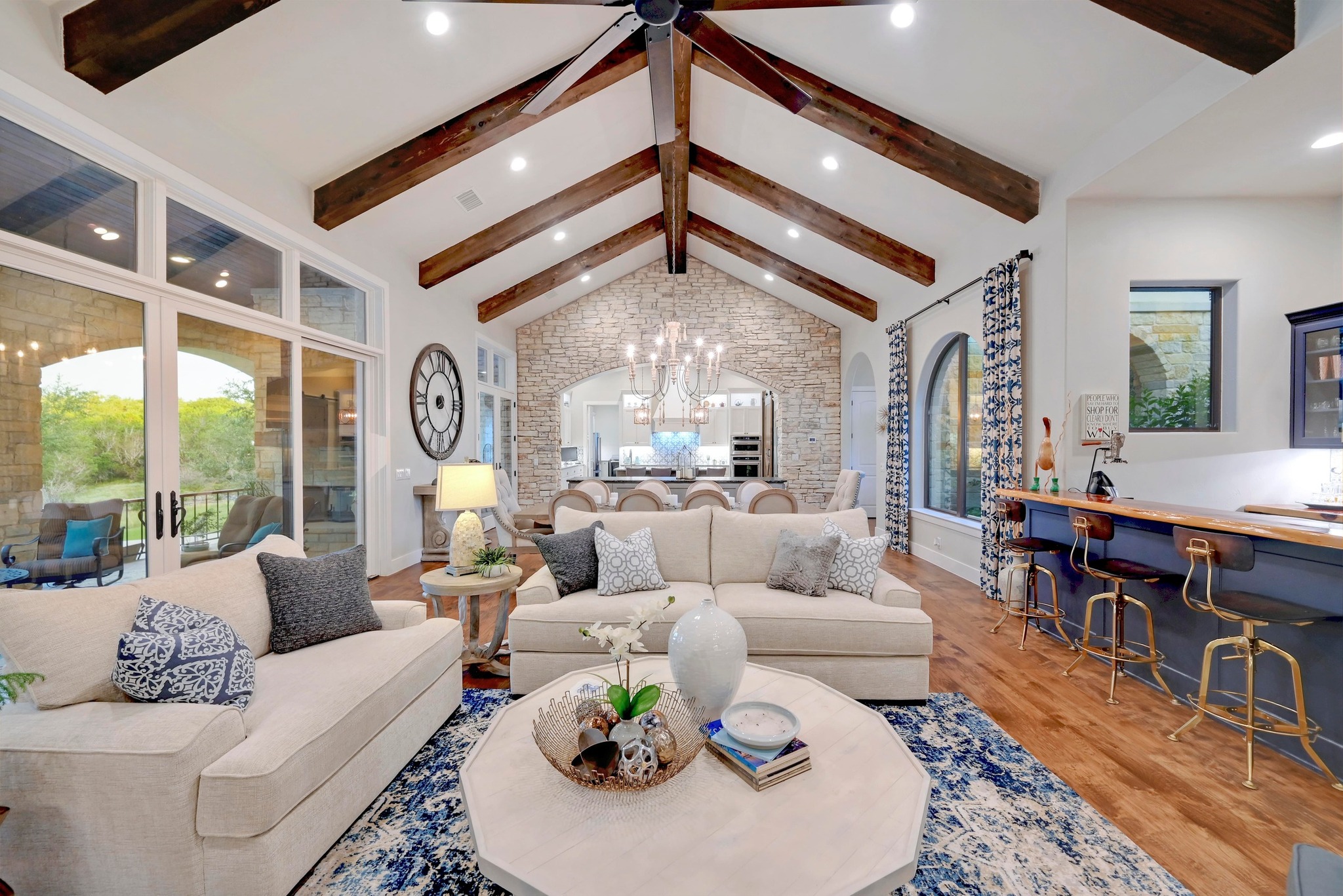 401 Trail Ridge Road Wimberley, TX 78676 - Photo 4 of 34 Living area featuring beam ceiling, light wood-type flooring, a chandelier, high vaulted ceiling, and recessed lighting