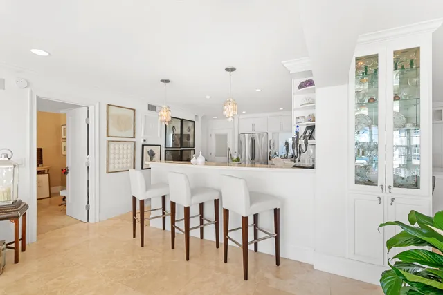 a kitchen with stainless steel appliances kitchen island granite countertop a sink and cabinets