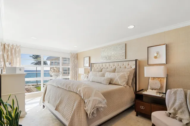 a bedroom with furniture and a chandelier