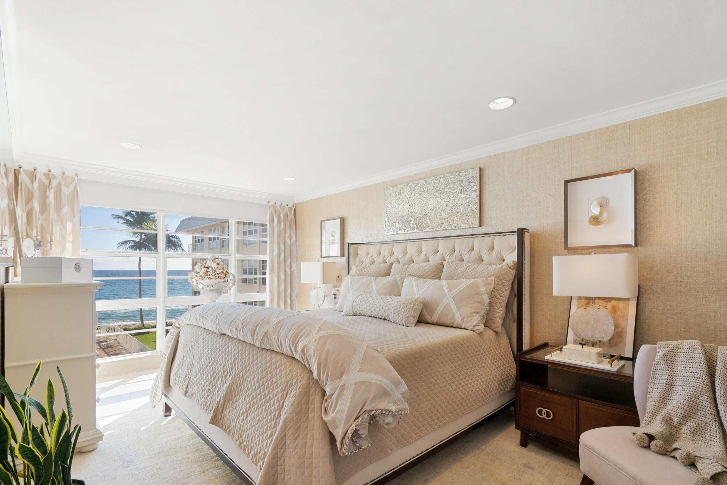 3851 North Ocean Boulevard, Unit 307308 Gulf Stream, FL 33483 - Photo 20 of 26 a bedroom with a bed and a couch