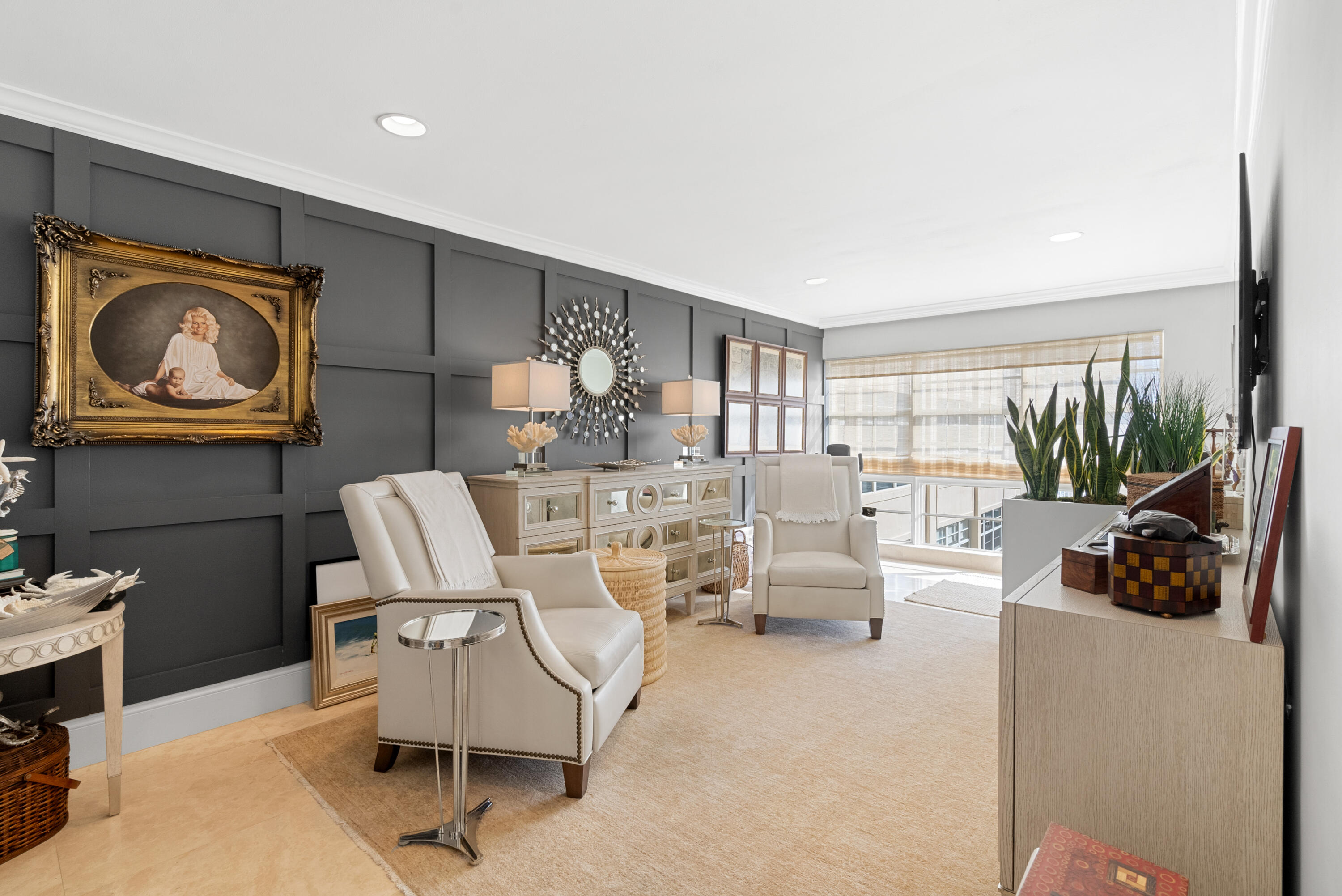 3851 North Ocean Boulevard, Unit 307308 Gulf Stream, FL 33483 - Photo 2 of 26 a living room with furniture and a floor to ceiling window