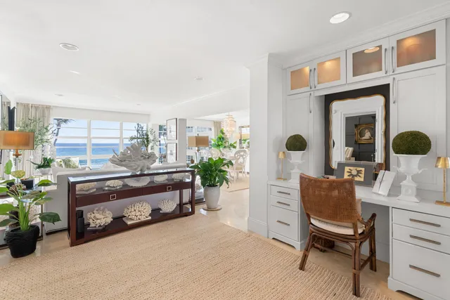 a living room with furniture and a chair