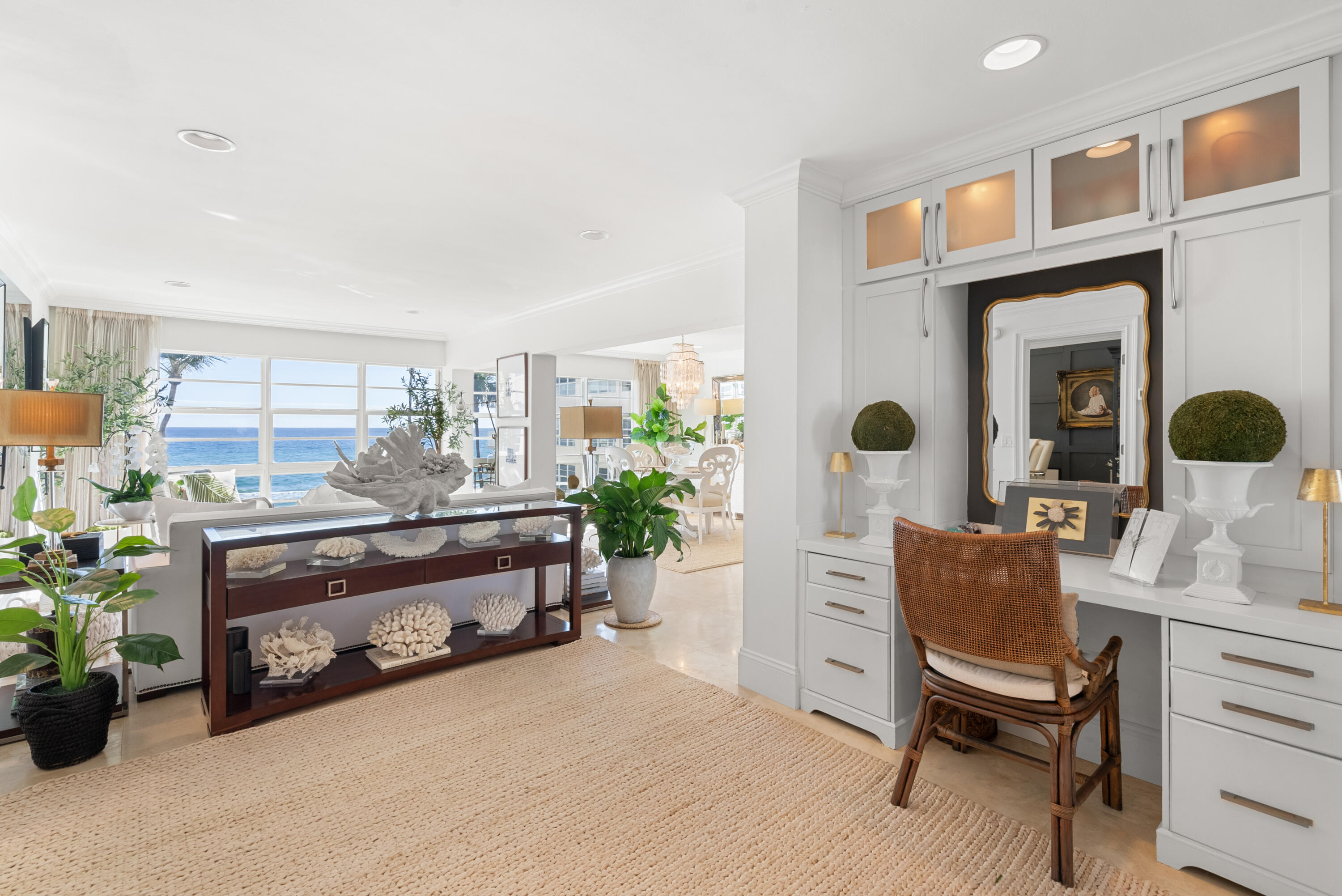 3851 North Ocean Boulevard, Unit 307308 Gulf Stream, FL 33483 - Photo 5 of 26 a living room with furniture and a chair