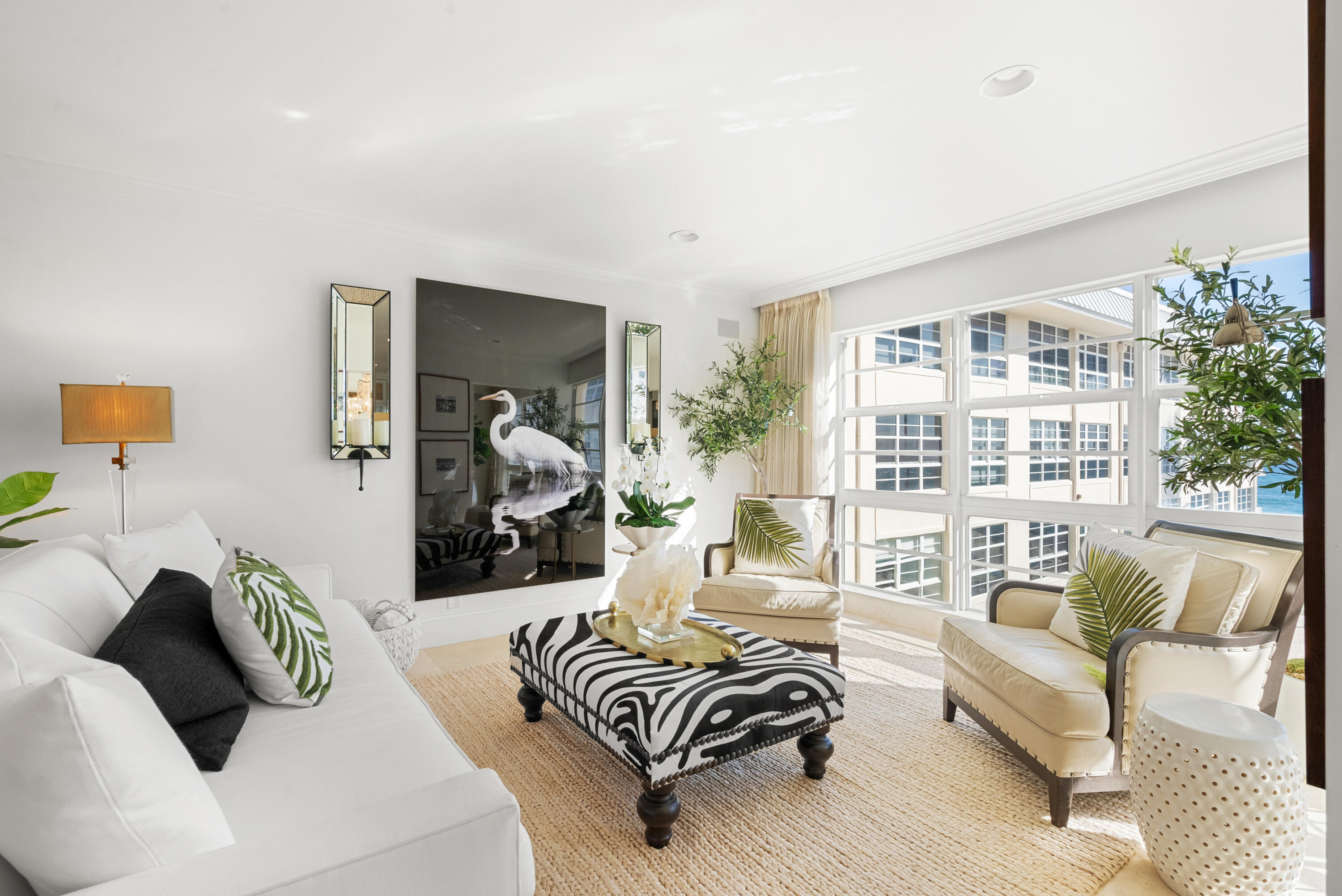 3851 North Ocean Boulevard, Unit 307308 Gulf Stream, FL 33483 - Photo 8 of 26 a living room with furniture and a large window