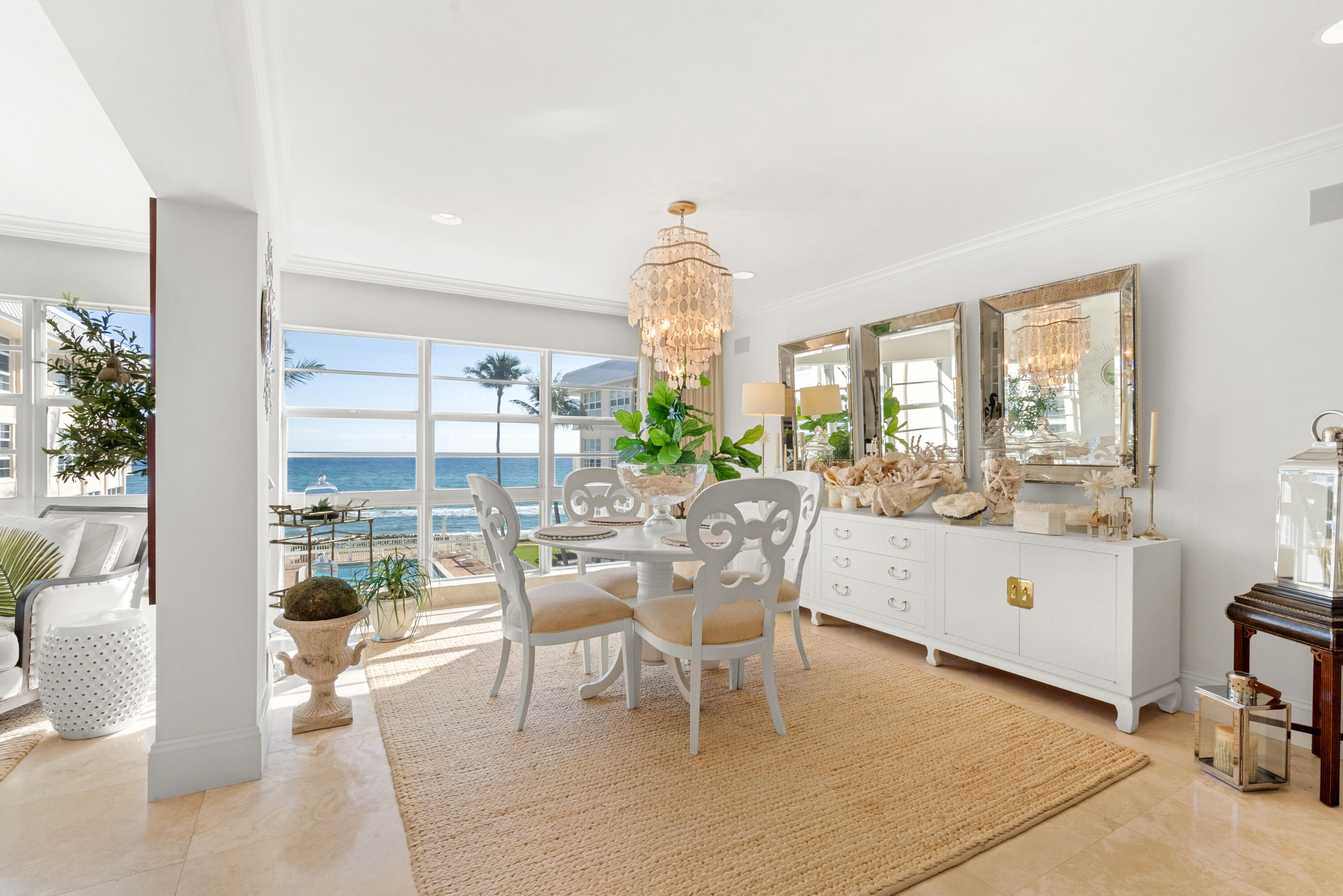 3851 North Ocean Boulevard, Unit 307308 Gulf Stream, FL 33483 - Photo 10 of 26 a living room with furniture a window and a dining table