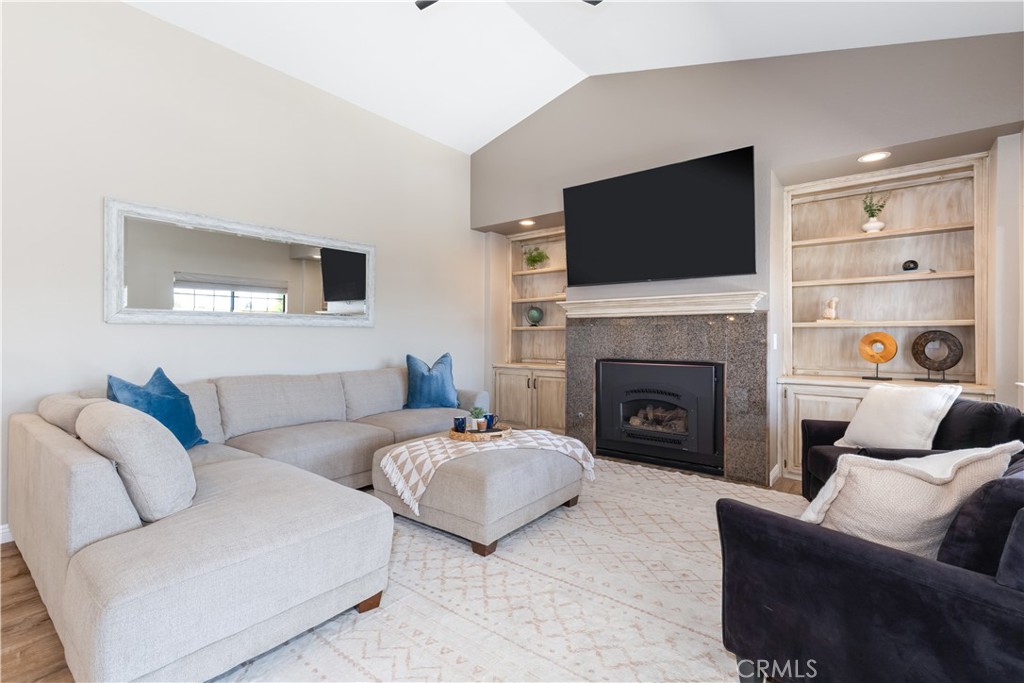 1275 Shane Lane Templeton, CA 93465 - Photo 20 of 70 a living room with furniture a flat screen tv and a fireplace