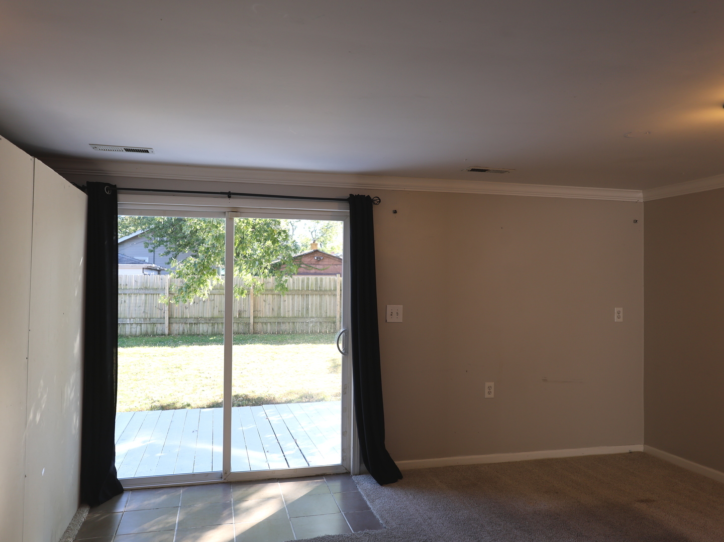 917 North Linden Avenue Waukegan, IL 60085 - Photo 11 of 14 an empty room with wooden floor and windows
