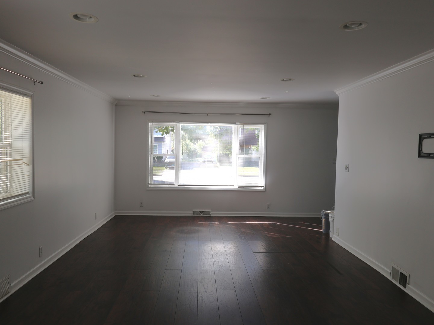 917 North Linden Avenue Waukegan, IL 60085 - Photo 7 of 14 an empty room with wooden floor and windows