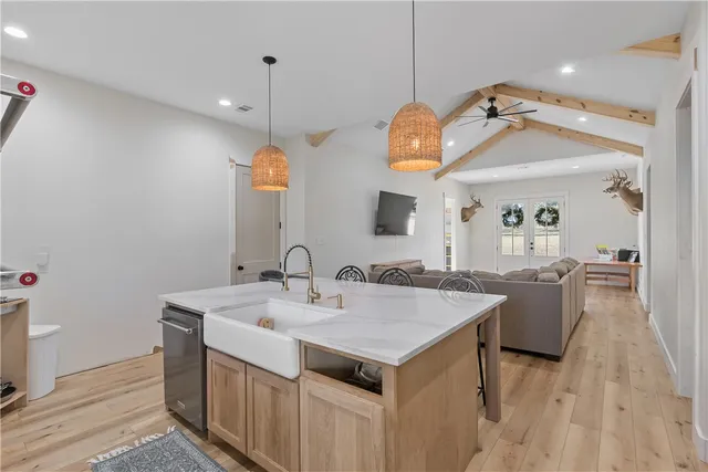 a view of a sink and mirror in a room