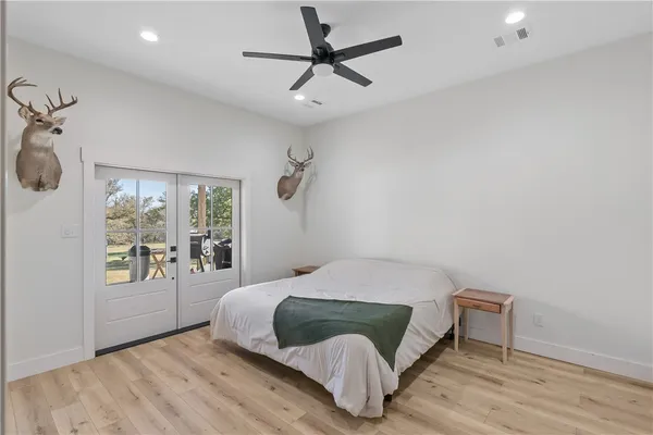a bedroom with a bed and window