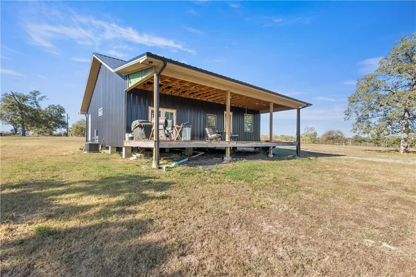 a house view with a backyard space