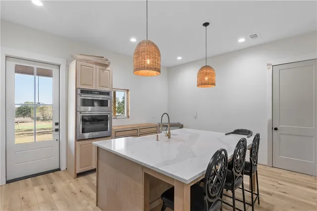 a kitchen with a table and chairs in it
