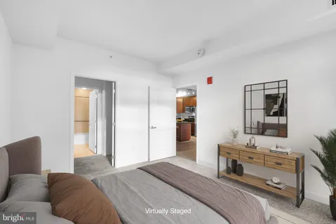 a bedroom with furniture and a potted plant