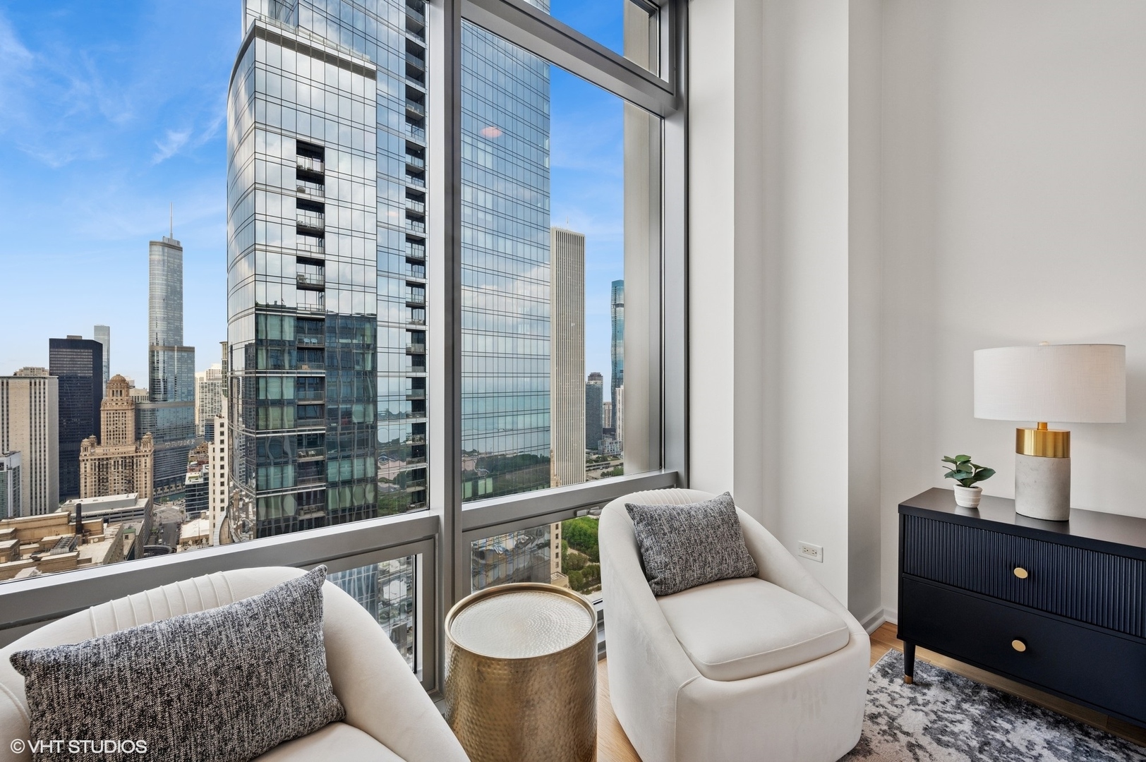 65 East Monroe Street, Unit 4623 Chicago, IL 60603 - Photo 13 of 26 a bathroom with a granite countertop sink and a mirror