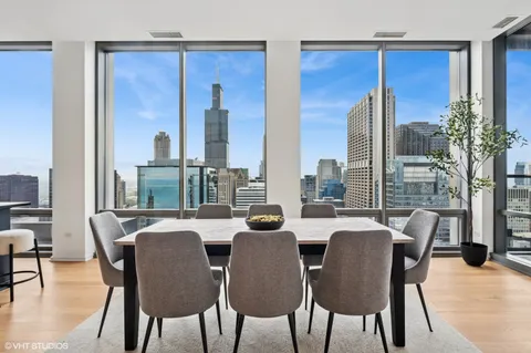 a view of a dining room with furniture window and outside view