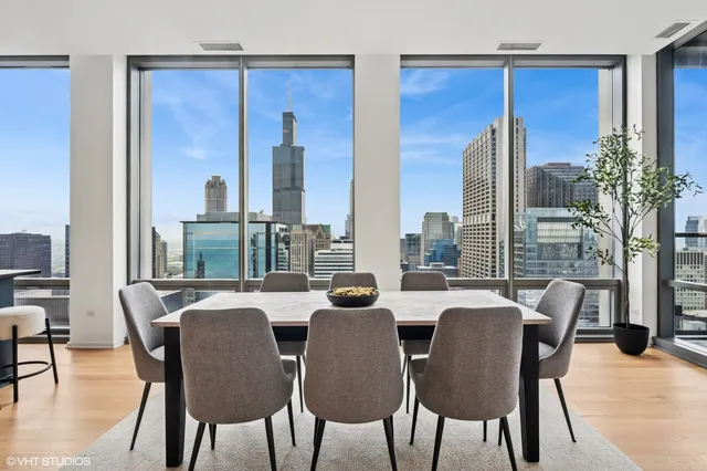 a view of a dining room with furniture window and outside view
