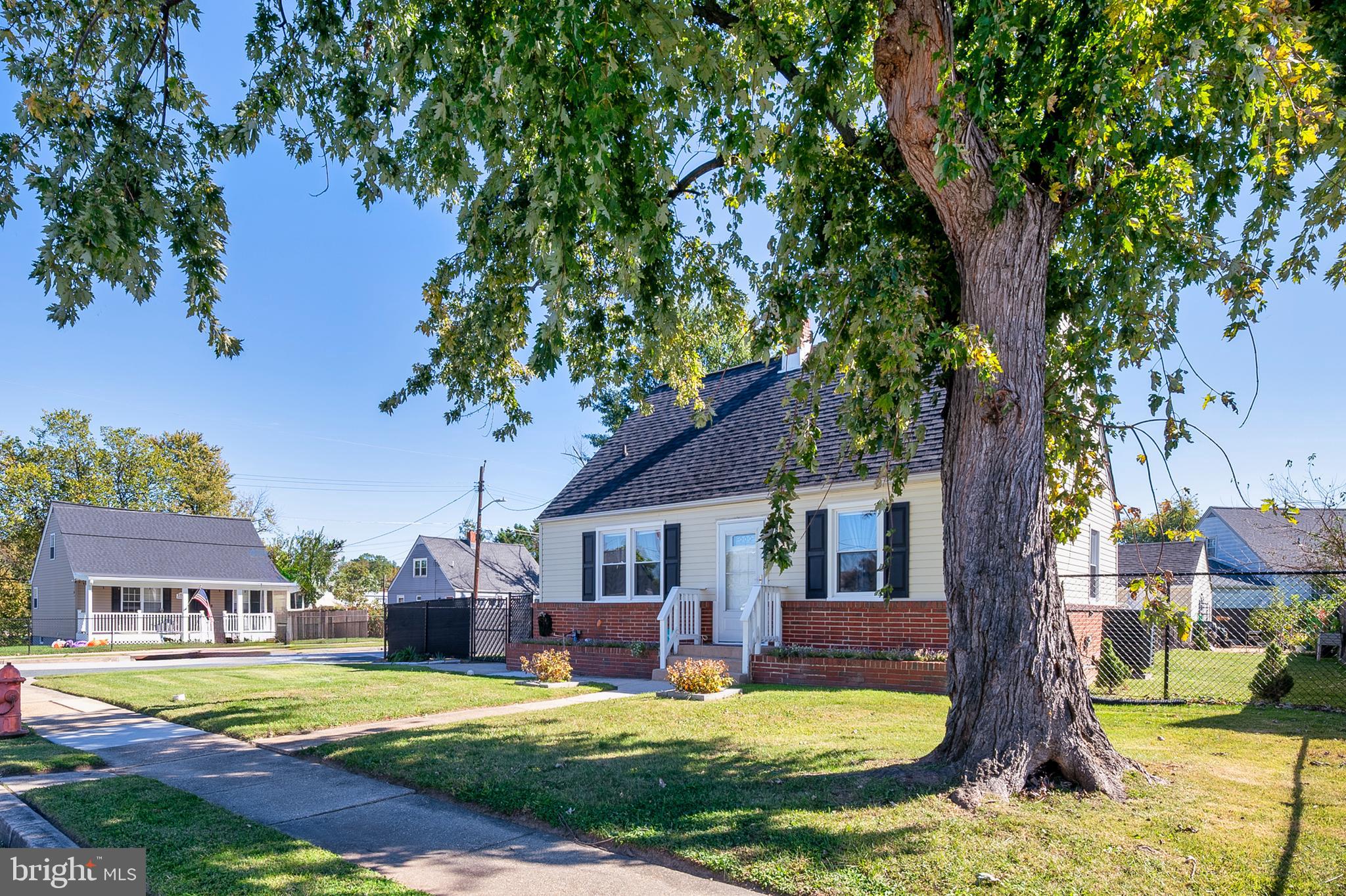 a view of a house with swimming pool and a big yard
