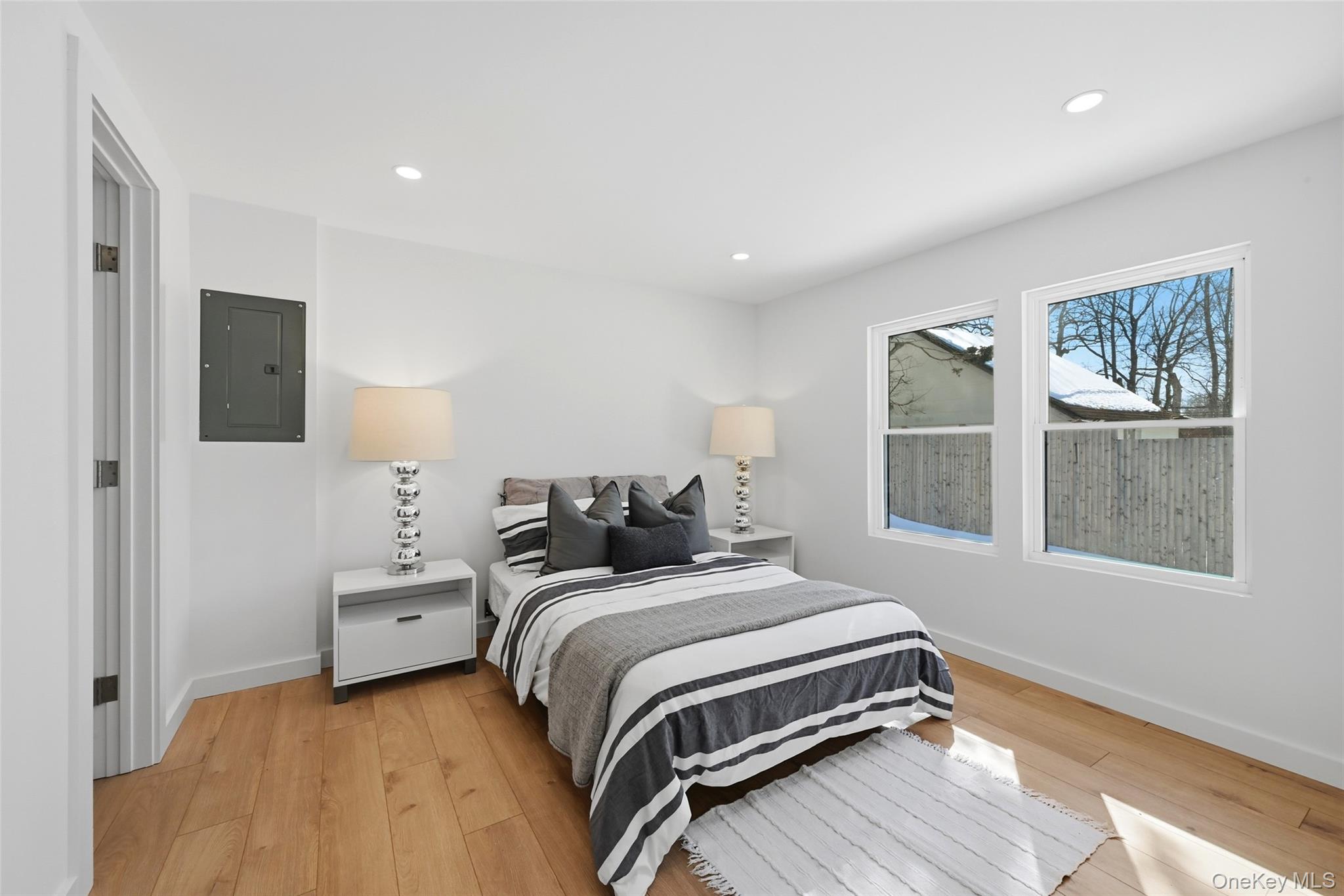 923 East Main Street Riverhead, NY 11901 - Photo 16 of 30 a bedroom with a bed and a window