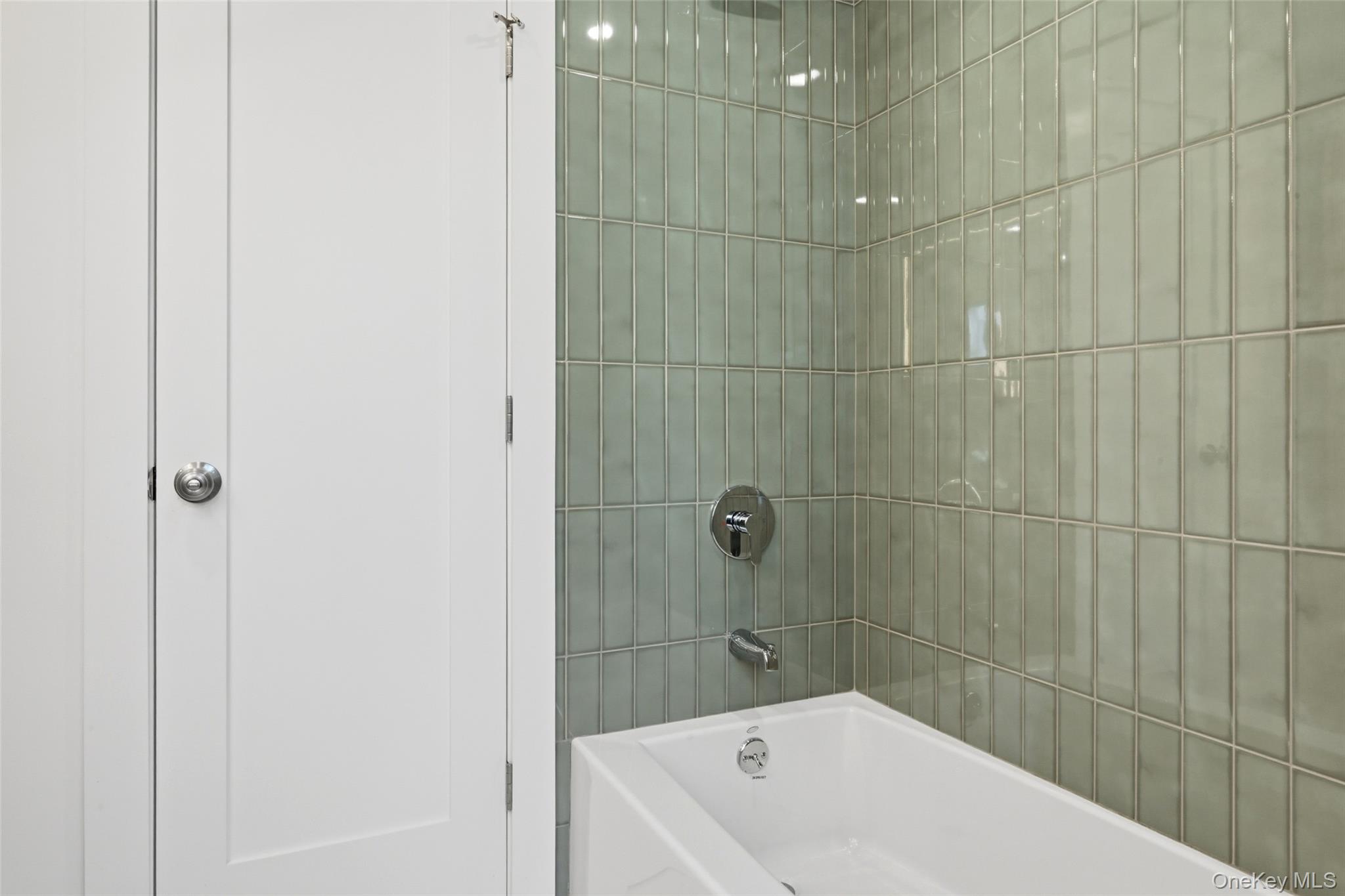 923 East Main Street Riverhead, NY 11901 - Photo 22 of 30 a bathroom with a bathtub and shower