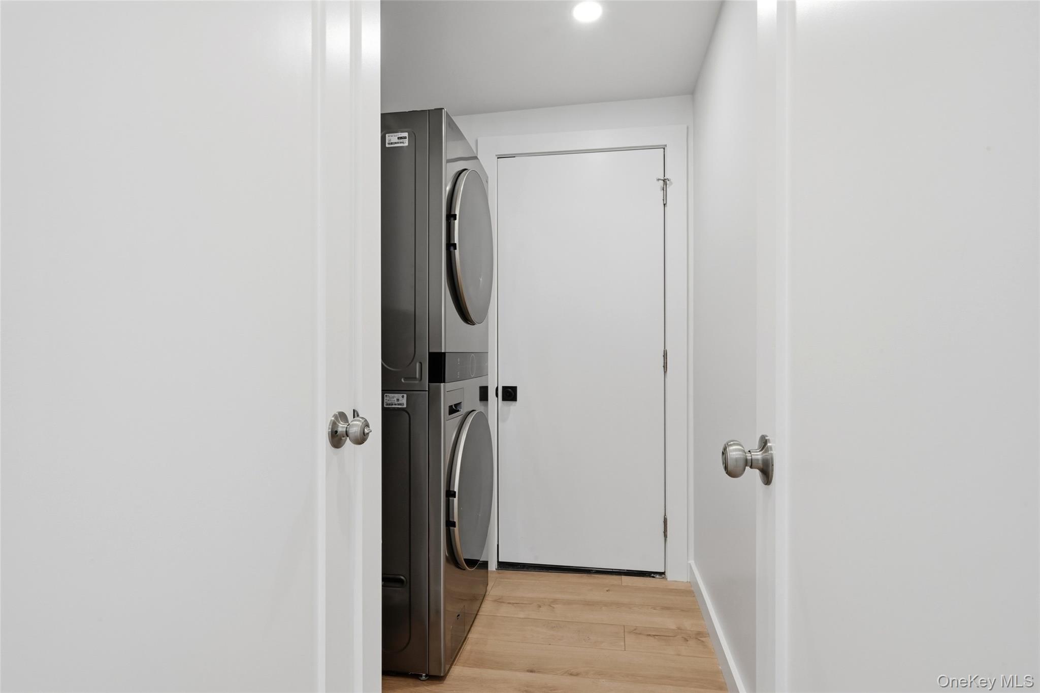 923 East Main Street Riverhead, NY 11901 - Photo 25 of 30 a bathroom with a glass shower door