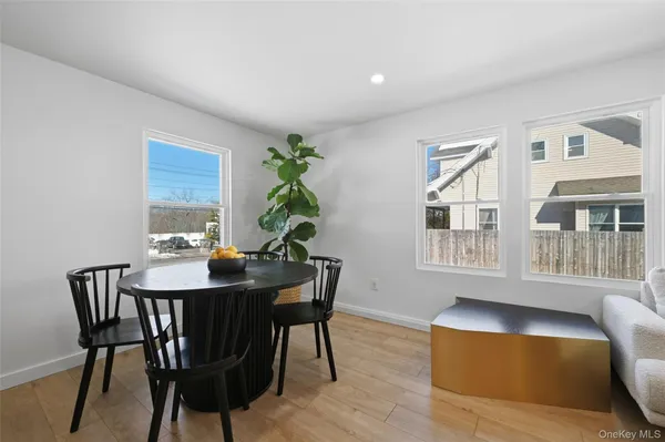 a view of a dining room with furniture and window
