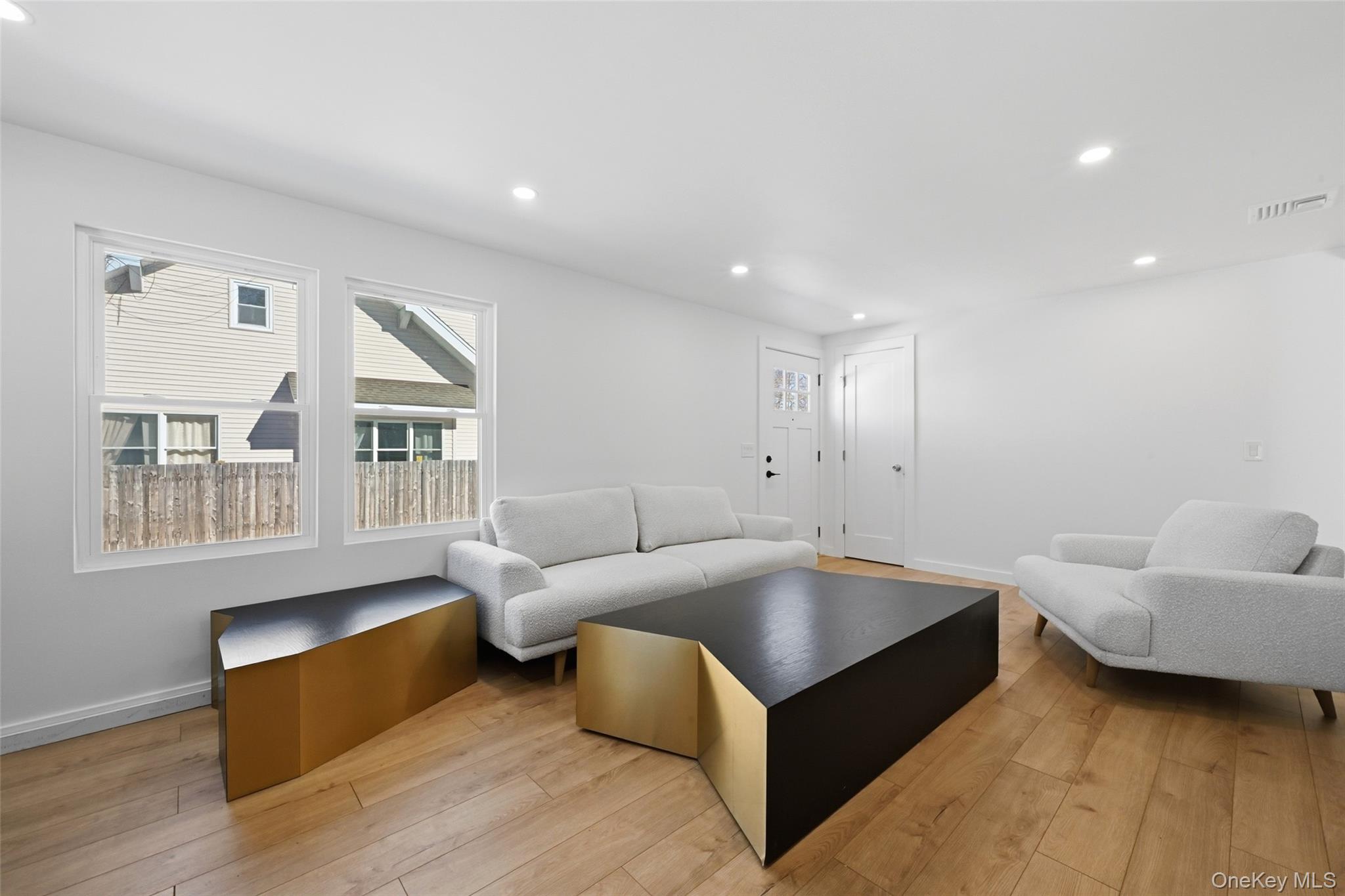 923 East Main Street Riverhead, NY 11901 - Photo 6 of 30 a living room with furniture and a window