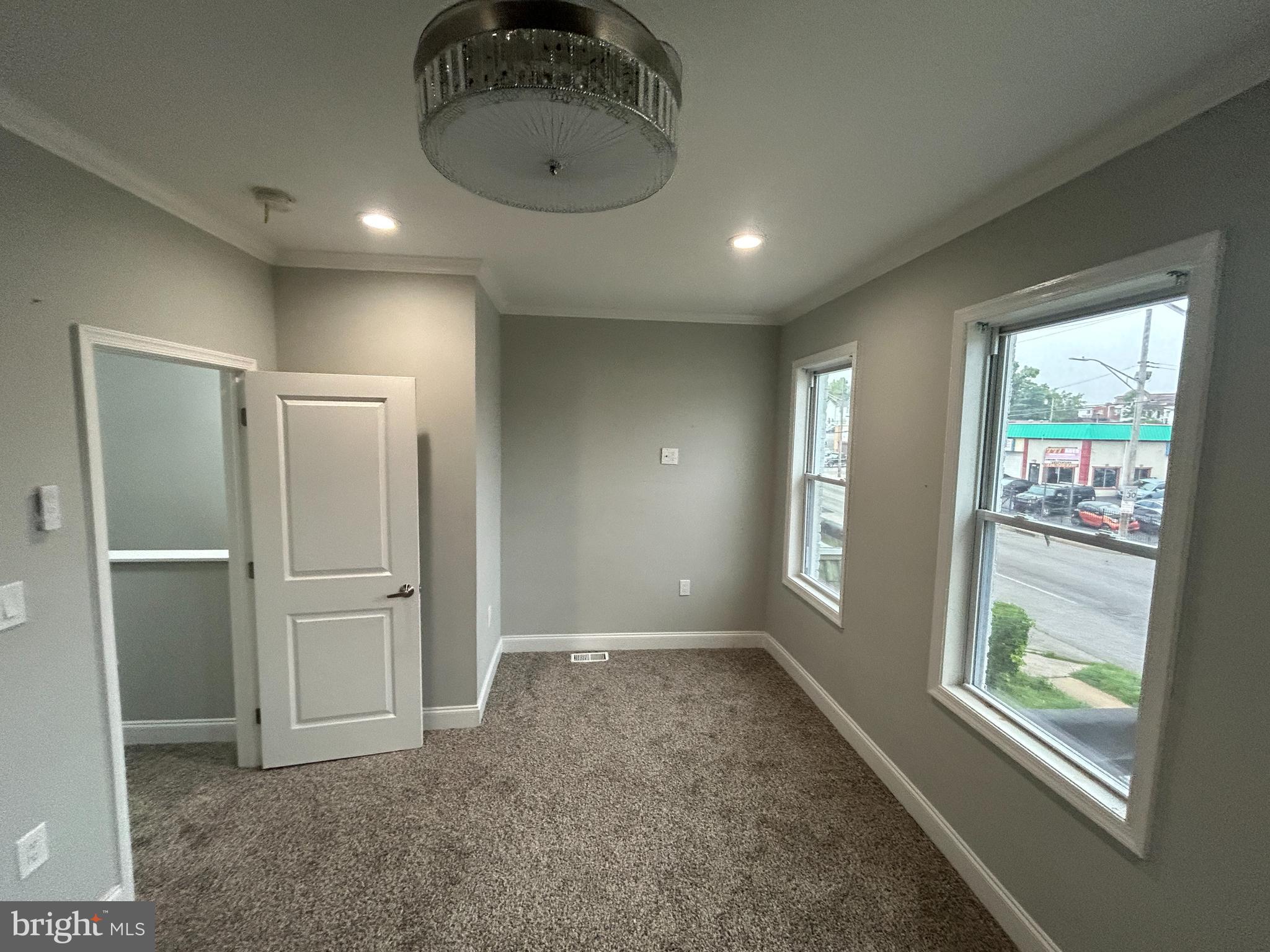 4140 Reisterstown Road Baltimore, MD 21215 - Photo 11 of 18 a view of an empty room with a window