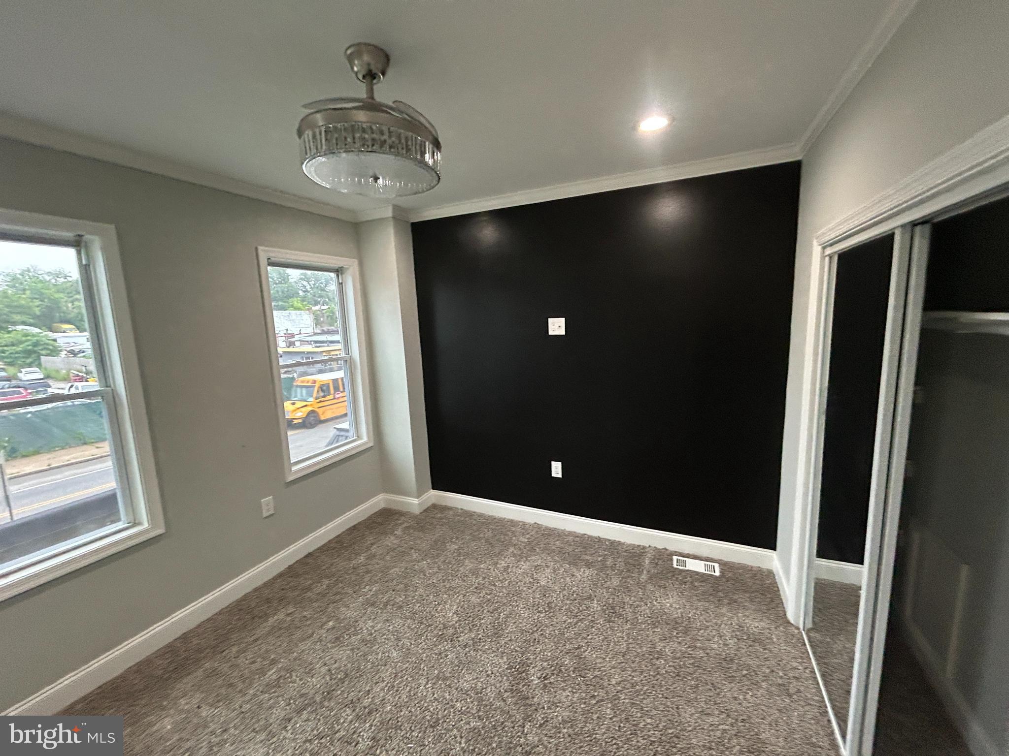 4140 Reisterstown Road Baltimore, MD 21215 - Photo 12 of 18 a view of an empty room with a window