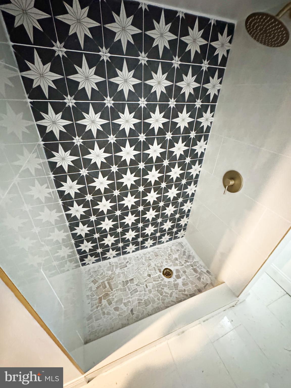 4140 Reisterstown Road Baltimore, MD 21215 - Photo 18 of 18 a bathroom with a bathtub and shower