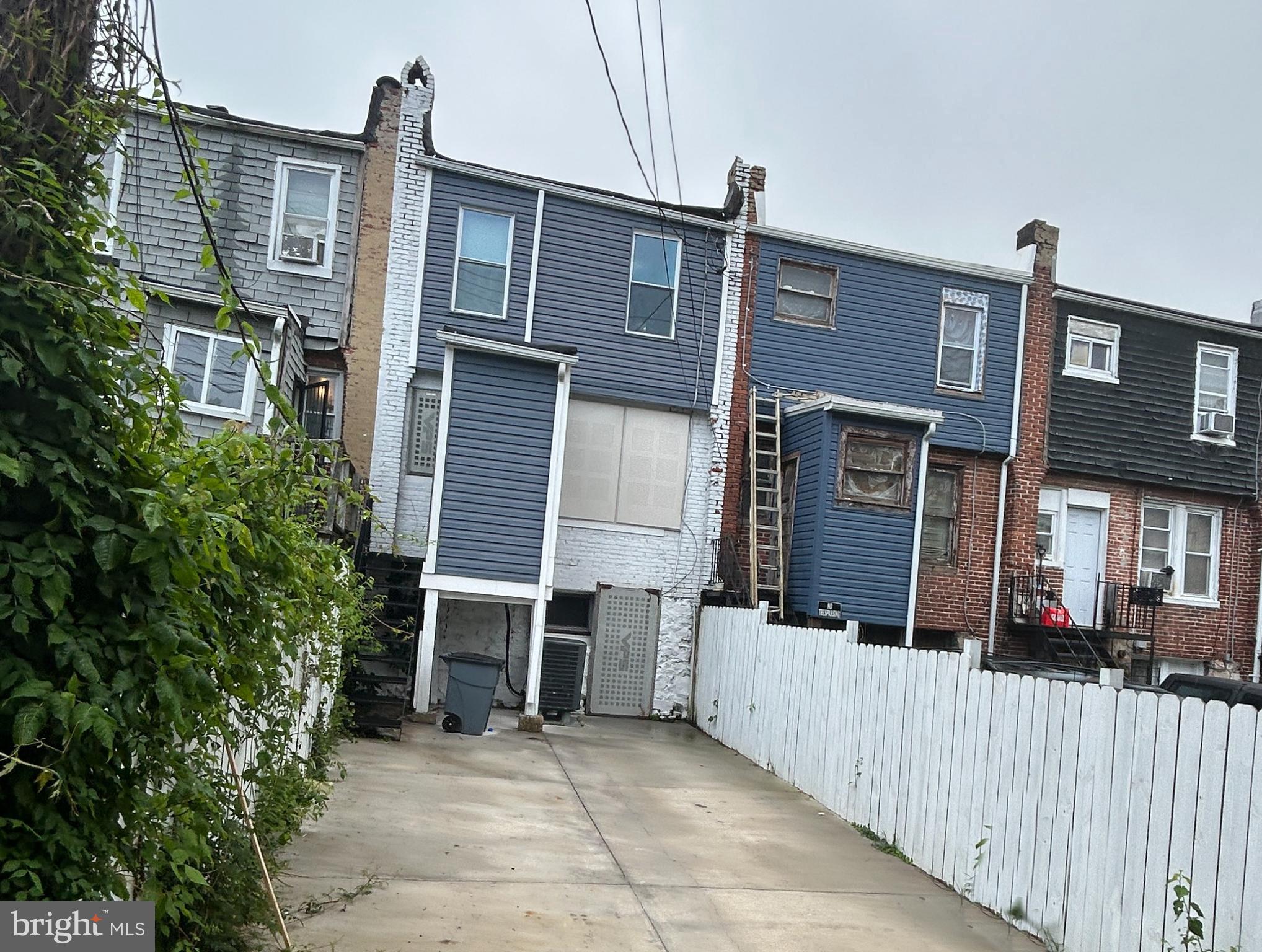 4140 Reisterstown Road Baltimore, MD 21215 - Photo 3 of 18 a view of a house with wooden fence