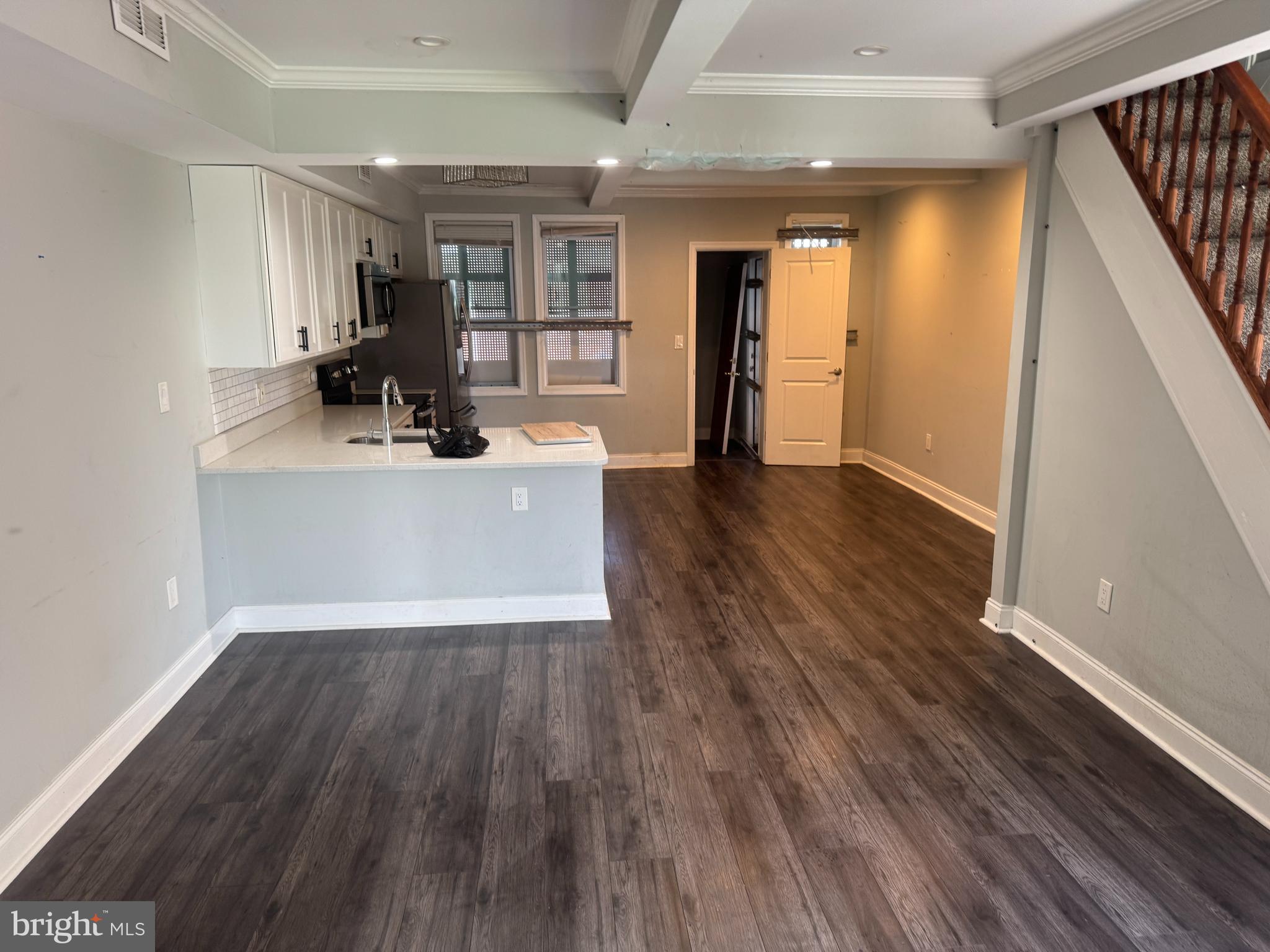 4140 Reisterstown Road Baltimore, MD 21215 - Photo 4 of 18 a view of kitchen with cabinets and wooden floor