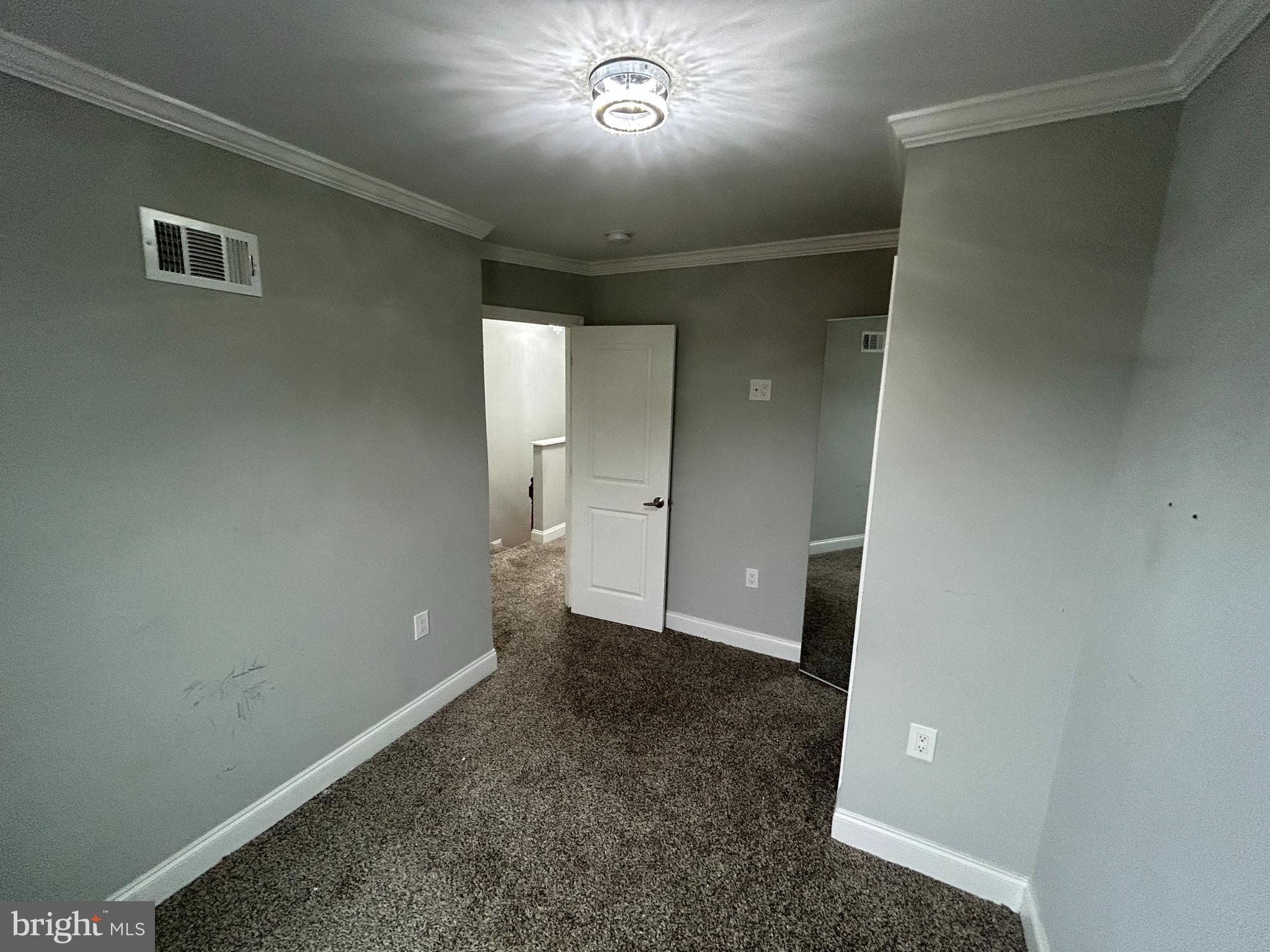 4140 Reisterstown Road Baltimore, MD 21215 - Photo 10 of 18 an empty room with a bathroom