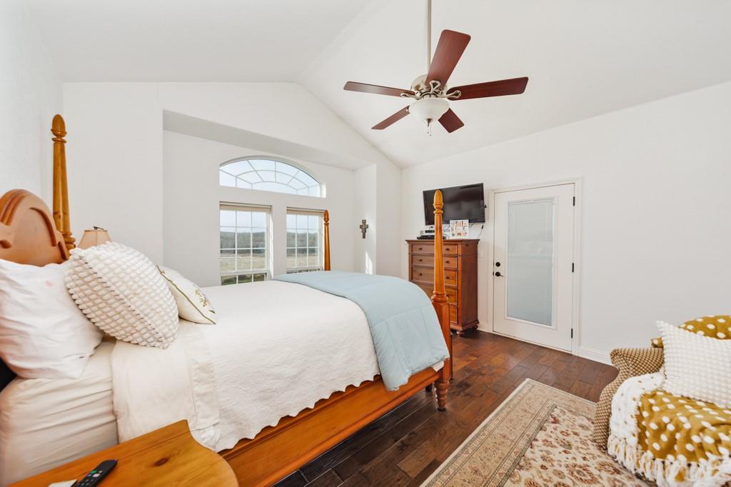 4460 Hildreth Pool Road Bowie, TX 76230 - Photo 16 of 40 a bedroom with a bed and wooden floor