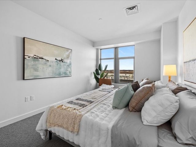 a bathroom with a double vanity sink and mirror