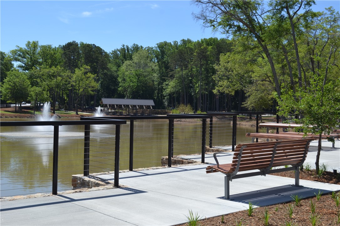 205 B East Broad Street Anderson, SC 29621 - Photo 20 of 21 This tranquil lakeside retreat offers a serene escape with scenic water features and ample seating.