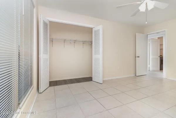 an empty room with fan