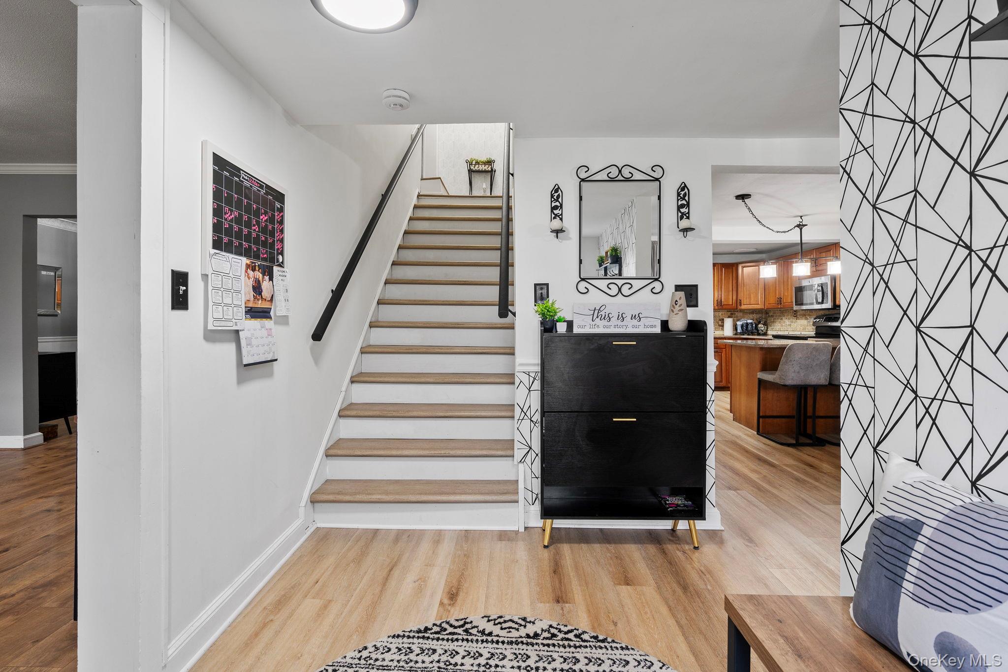168 Fostertown Road Newburgh, NY 12550 - Photo 12 of 38 Stairs with wood finished floors and crown molding