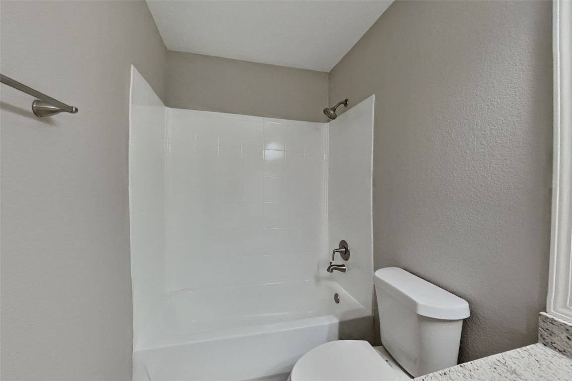 6423 Lily Hollow Court Spring, TX 77379 - Photo 15 of 20 a white toilet sitting next to a bath tub